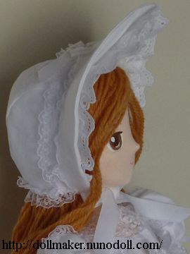 Girl doll in bonnet
