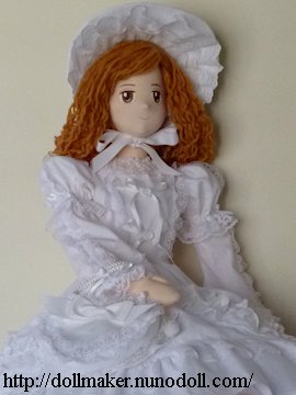 Girl doll holds a bag