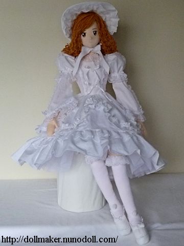 Doll in white dress