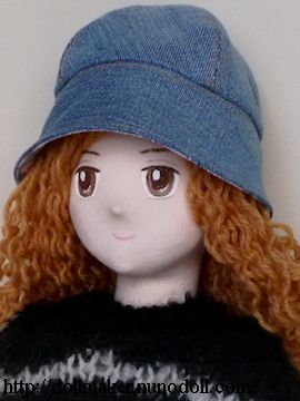 Girl doll in denim hat